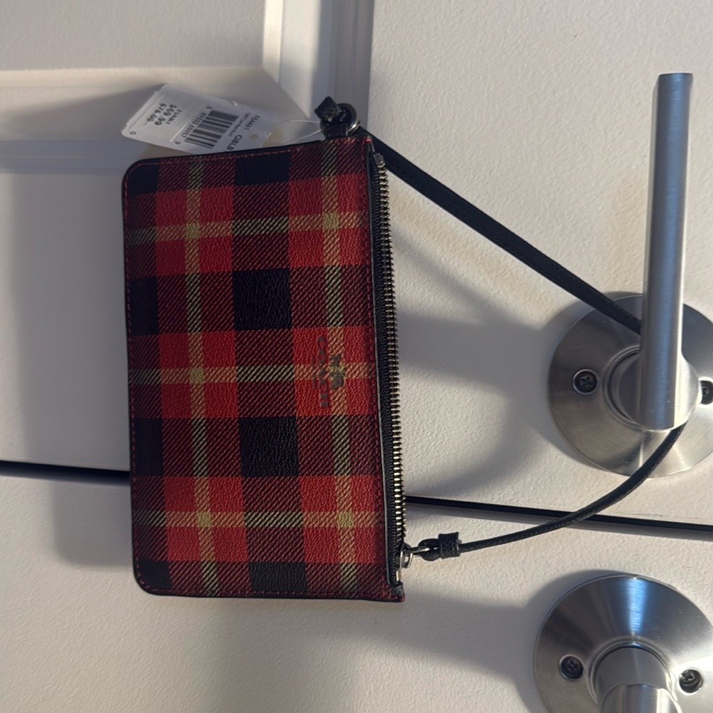 Brand new red plaid coach wristlet. Tags still on.